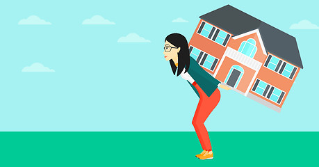 Image showing Woman carrying house.