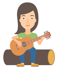 Image showing Woman playing guitar.