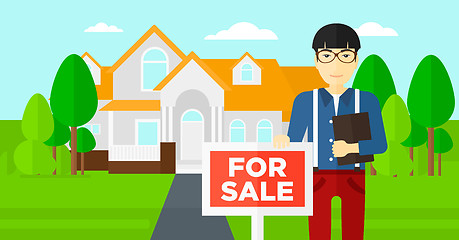 Image showing Real estate agent offering house.