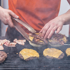 Image showing Beef burgers ready to serve on food stall.