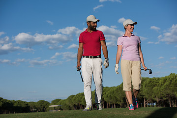 Image showing couple walking on golf course