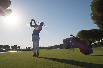 Image showing golf player hitting shot