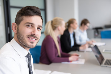 Image showing young business people group on team meeting at modern office