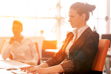 Image showing business woman at  office people group on meeting  in background