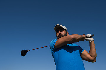 Image showing golf player hitting shot