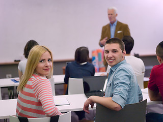 Image showing teacher with a group of students in classroom