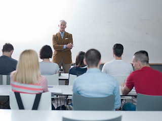 Image showing teacher with a group of students in classroom