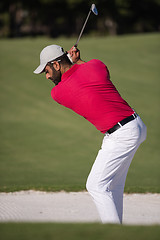 Image showing golfer hitting a sand bunker shot