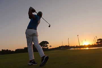 Image showing golfer hitting long shot