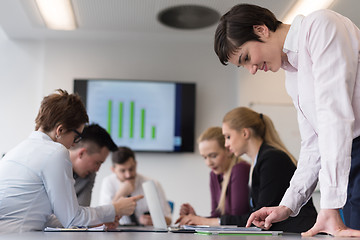 Image showing young  woman using  tablet on business meeting