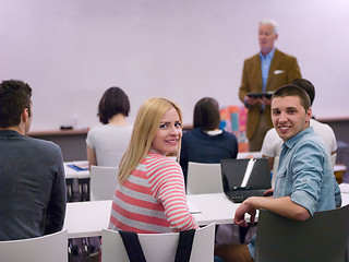 Image showing teacher with a group of students in classroom