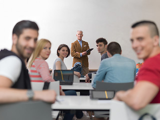 Image showing teacher with a group of students in classroom