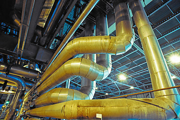 Image showing Equipment, cables and piping as found inside of a modern industr