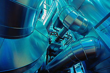 Image showing Equipment, cables and piping as found inside of a modern industr