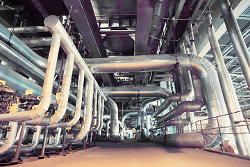 Image showing different size and shaped pipes and valves at a power plant 