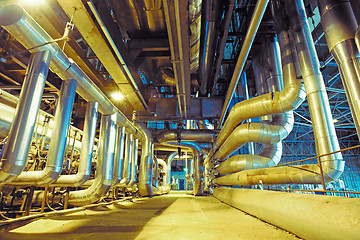 Image showing Equipment, cables and piping as found inside of a modern industr