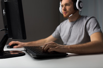 Image showing close up of man playing computer video game