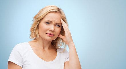 Image showing unhappy woman suffering from headache