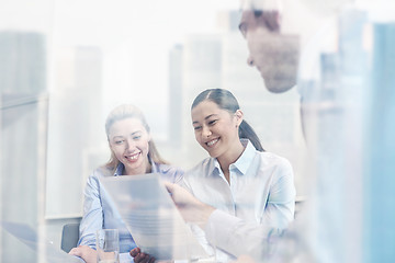 Image showing group of smiling businesspeople meeting in office