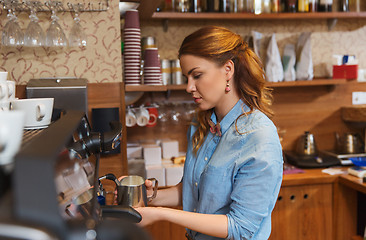 Image showing barista woman making coffee by machine at cafe