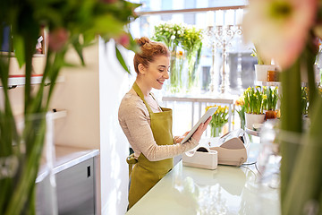 Image showing woman with tablet pc computer at flower shop