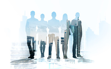 Image showing business people silhouettes over city background