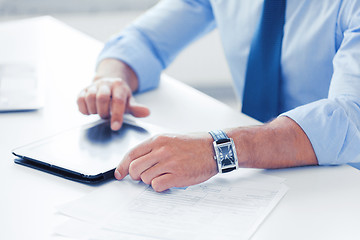 Image showing businessman with tablet pc in office