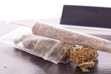 Image showing Dried Cannabis on Rolling Paper with Filter