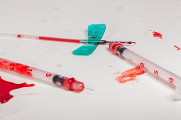 Image showing Syringes and IV Lines Covered with Blood