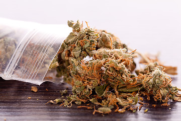 Image showing Close up Dried Marijuana Leaves on the Table