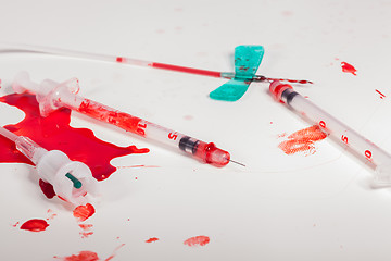 Image showing Syringes and IV Lines Covered with Blood