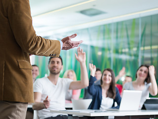 Image showing close up of teacher hand while teaching in classroom