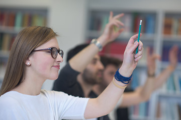 Image showing group of students  raise hands up