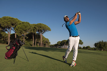 Image showing golf player hitting shot