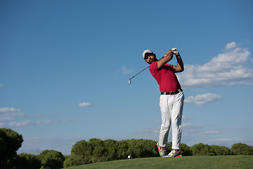 Image showing golf player hitting long shot