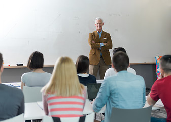 Image showing teacher with a group of students in classroom