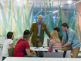 Image showing teacher with a group of students in classroom