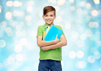 Image showing happy student boy with folders and notebooks