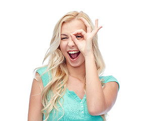 Image showing young woman making ok hand gesture