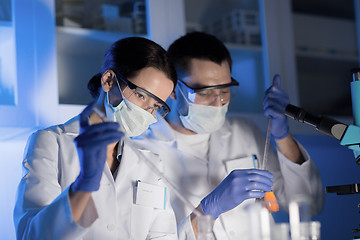Image showing close up of scientists making test in lab