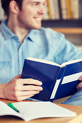 Image showing close up of student reading book at school