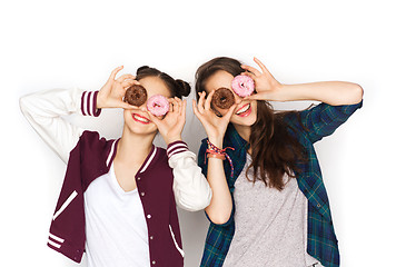 Image showing happy pretty teenage girls with donuts having fun