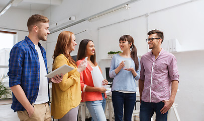 Image showing creative team on coffee break talking at office