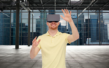 Image showing happy man in virtual reality headset or 3d glasses