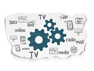 Image showing Advertising concept: Gears on Torn Paper background