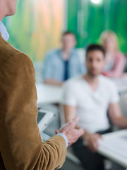 Image showing close up of teacher hand while teaching in classroom