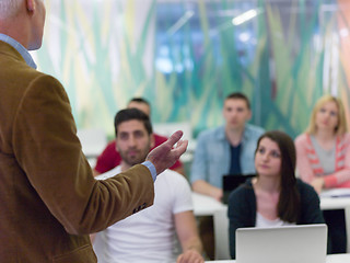 Image showing close up of teacher hand while teaching and explaining  lessons 