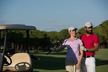 Image showing couple in buggy on golf course