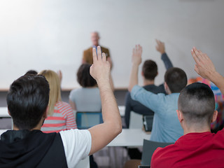 Image showing students group raise hands up on class