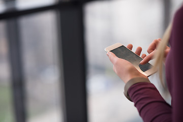 Image showing business woman using smart phone at office